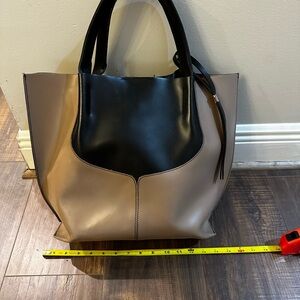 Large purse that is perfect for travel or making a statement!